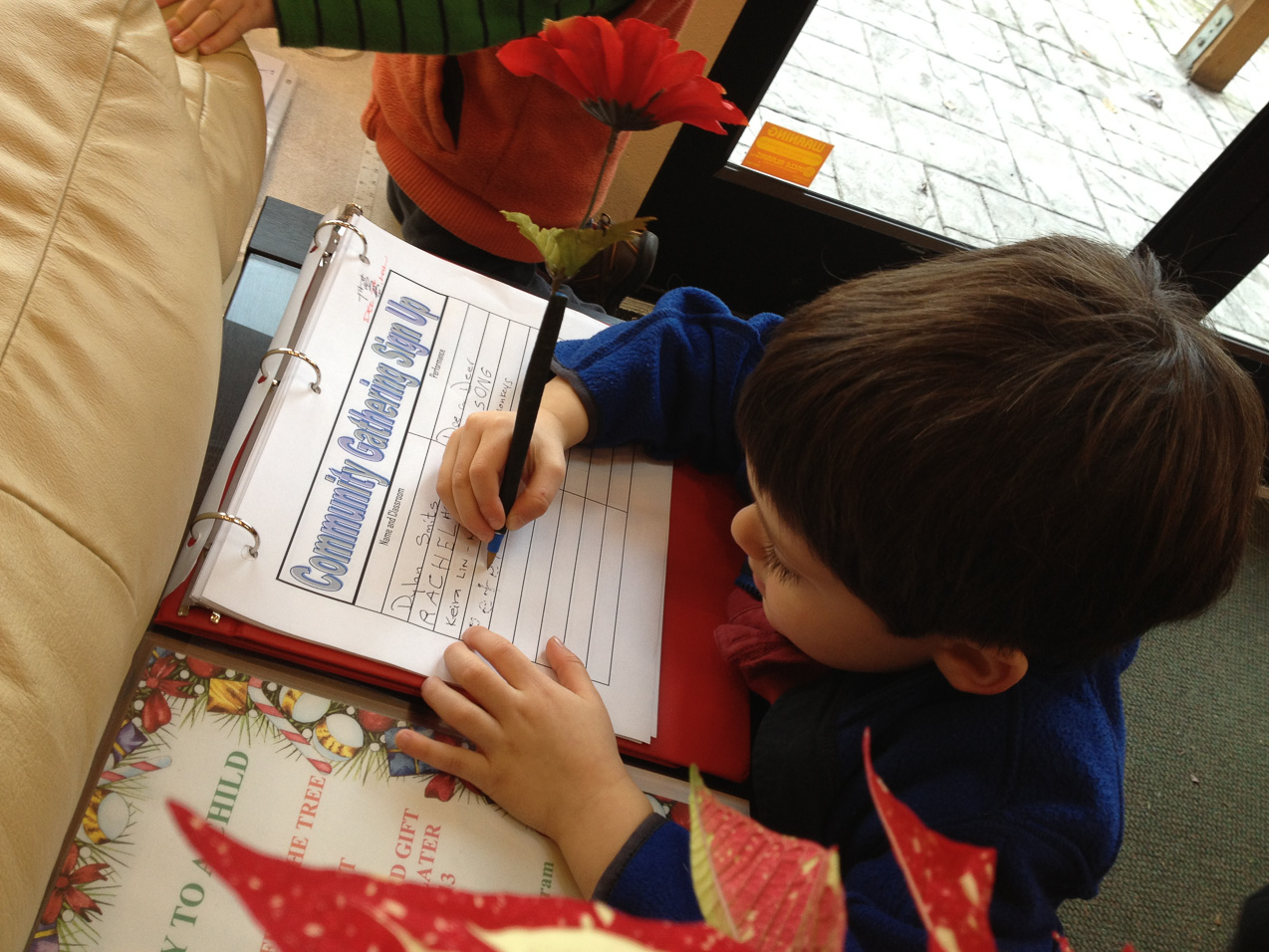  December 06, 2012 - Peter signs his name to play the piano for the assembly